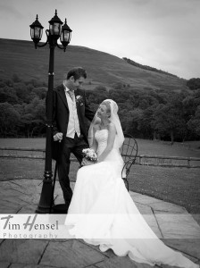 Copyright Tim Hensel photographer in Kent  bride and groom black and white bride sitting in chair