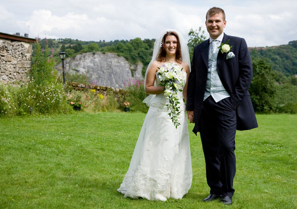 Bride and groom in countryside white trailing bouquet Tim Hensel photographer in Kent