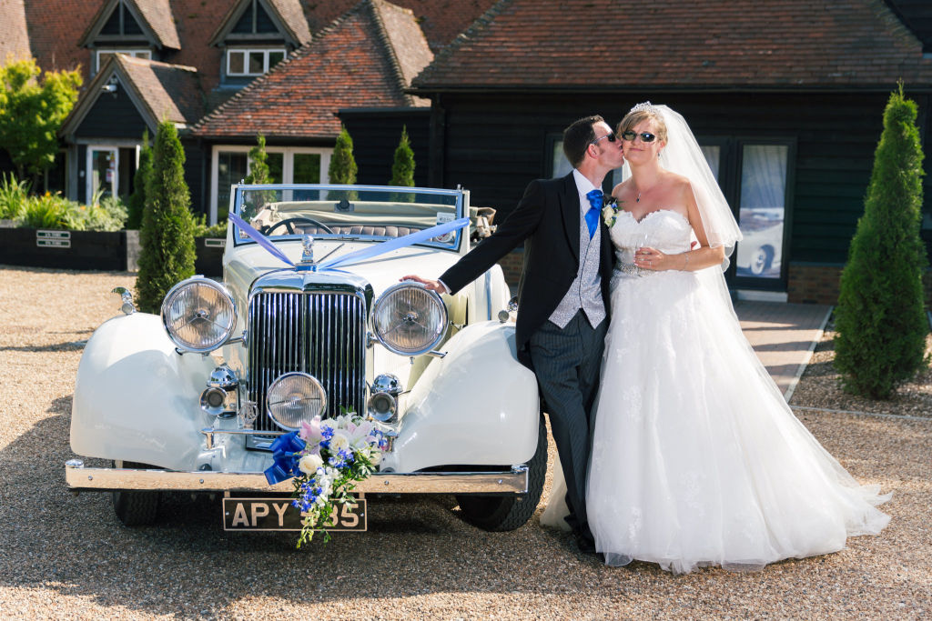 summer wedding photograph with bride and groom in sunglasses